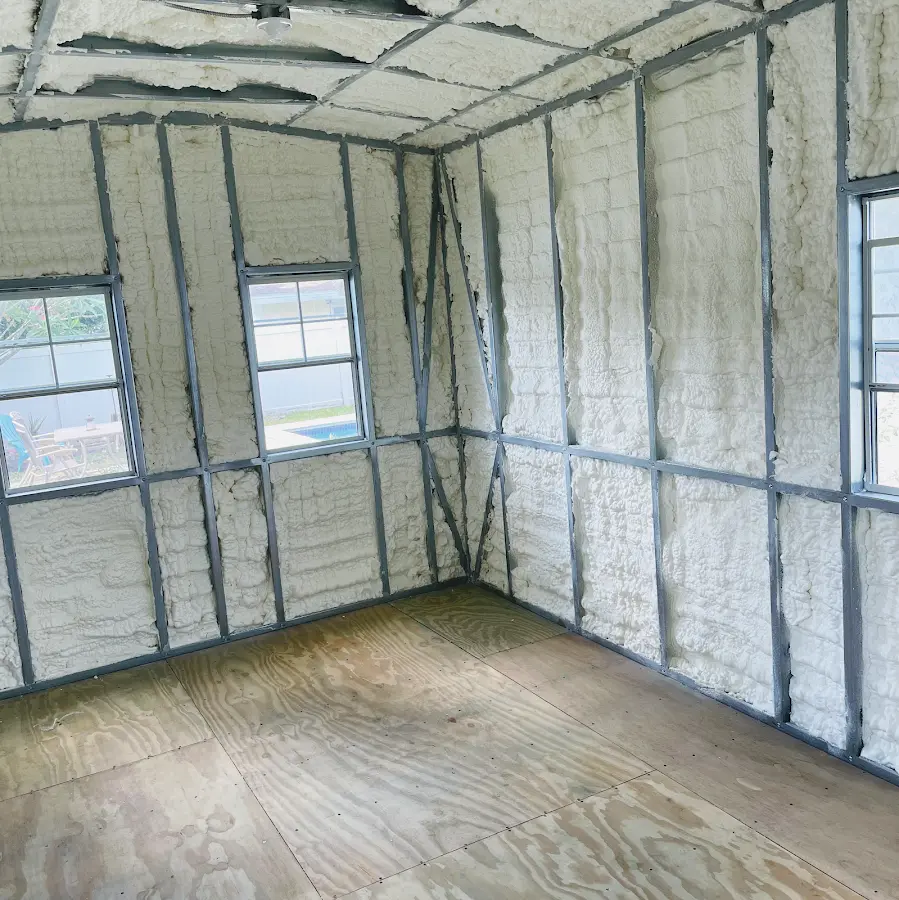 Closed-cell spray foam insulation applied to wall cavities in a residential project in Algona