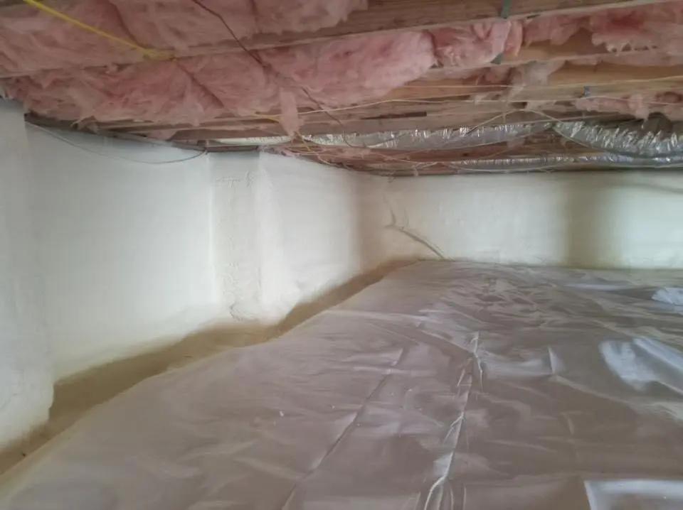 Crawl space encapsulation with closed-cell spray foam for Commercial Roof Restoration in Algona